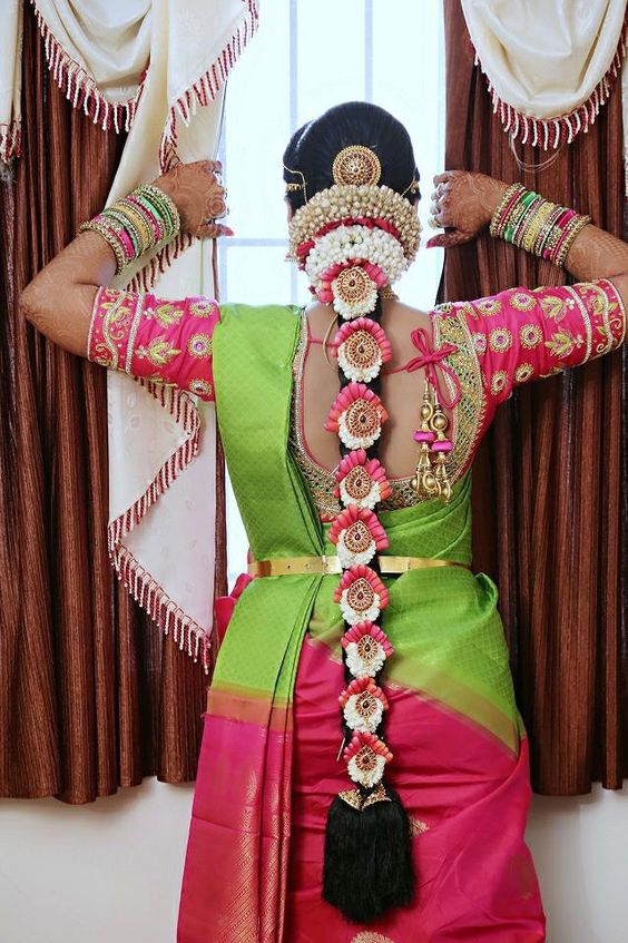 Floral Braided hairstyle for south Indian brides. 