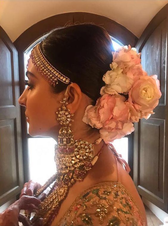 Floral Bun Haistyle on Anushka Sharma bride